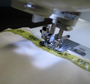 Sew along each side of the measuring tape using monofilament nylon thread.