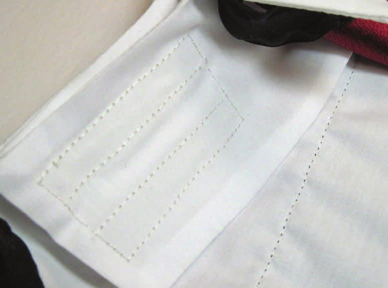 step six Place the two white collar pieces right sides together; place the interfacing on the wrong side of one