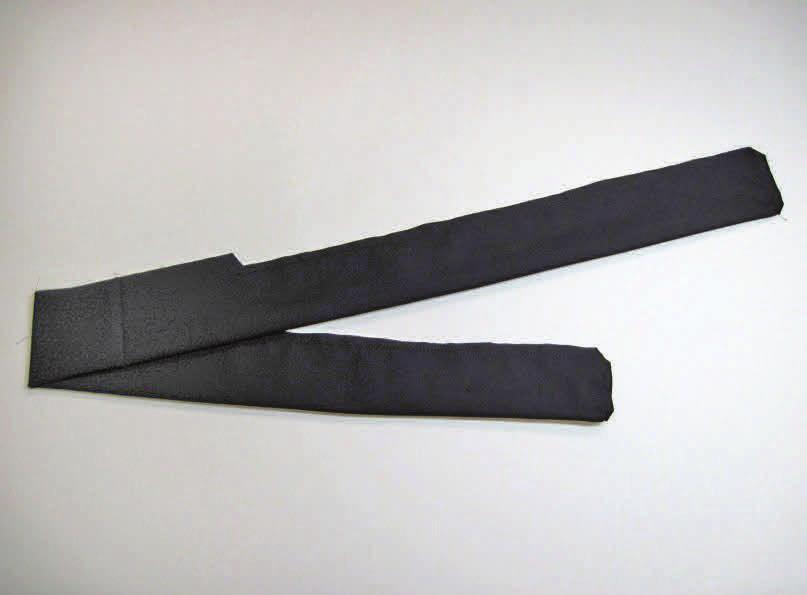 step ten Cut a 25ʺ x 6ʺ strip of black fabric for the belt. Fold it in half lengthwise; pin.