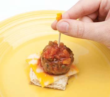 10 10 Put a slice of cheese on a roll. Put a meatball on the cheese.
