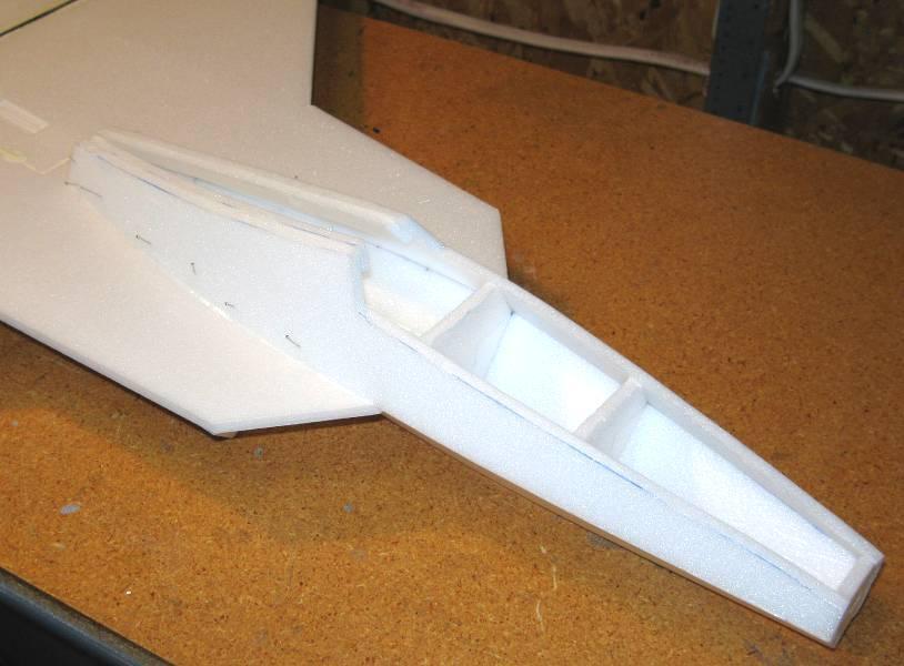 12. Glue bulkheads F4 and F5 to the top of the wing in the locations shown on the plans.