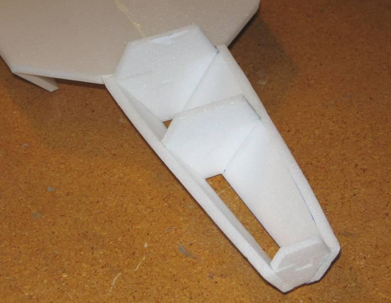 11. Use a sanding block to lightly sand the top of the lower forward fuselage until it is flat and even.
