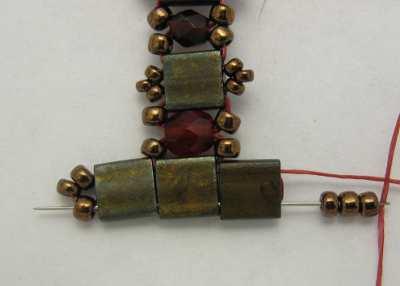 61. Pick up another 3 copper 11/0 beads; pass through the end holes of the Tila bar and through