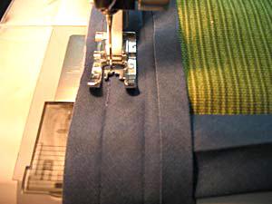 Stitch along the fold closest to the edge, starting at the end where you started