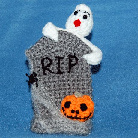 Halloween Tombstone Pattern An eerie Halloween decoration fit for any Halloween party or just as a decoration. There is a sweet little ghostie is peeking over the spider and web covered Tombstone.