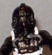 On the front of the helmet, where the hoses meet the mask, is a small section that can also be painted dark grey.