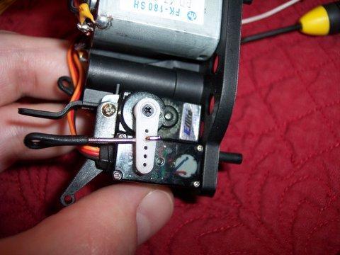 The starboard side servo is held by one screw at the top and double stick tape at the bottom. Disassembled BCX. Can I put this back together?