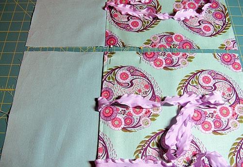 23. Overlap the back fabric panel on the back solid panel until it is exactly the same width as the