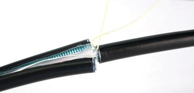 After about a half of an inch, unravel cord and rewrap it to form a T-handle on the pliers as shown in this photo.