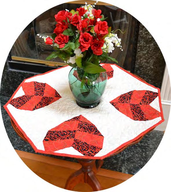 Table runner is an octagon shape measuring 24-3/4 at its widest point. Sample used fabric by Kona Bay.