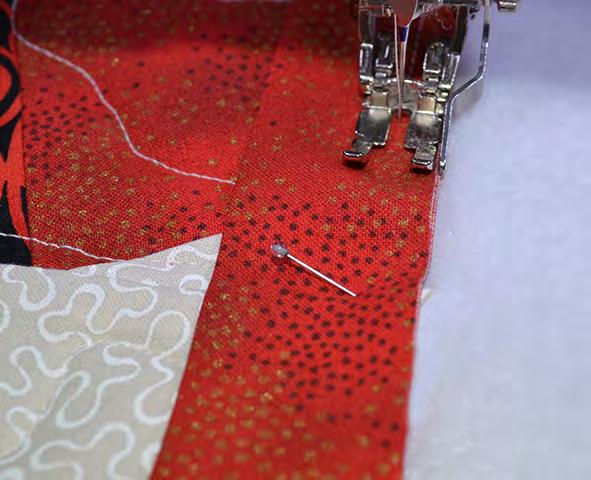 On the corner points of the table topper, place a mark where the seam allowance from both sides of the point cross each other (1/4 in from each edge.