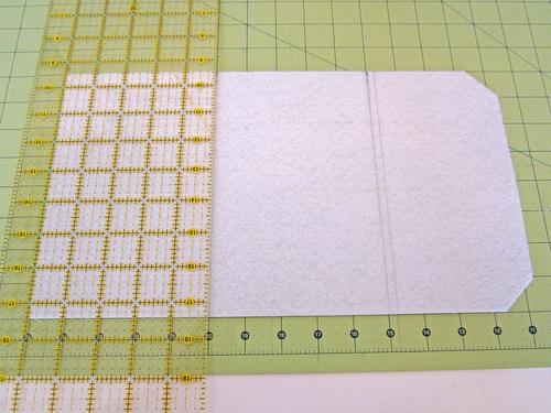 NOTE: If you have a gridded cutting mat, you can align the corners against a one inch square on the grid and cut through the middle of the square on the diagonal. 3.