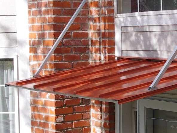 on the wall, using the following procedure: - Assemble the awning frame, install left and right flashings, left end panel, end brace brackets and braces (assembly steps 1-6, 10, 11, 12).