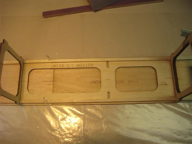 top of the fuselage bottom between formers #4 and #2 and