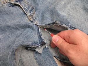 Using a seam ripper, open the inner seams on each pant leg up to the crotch.