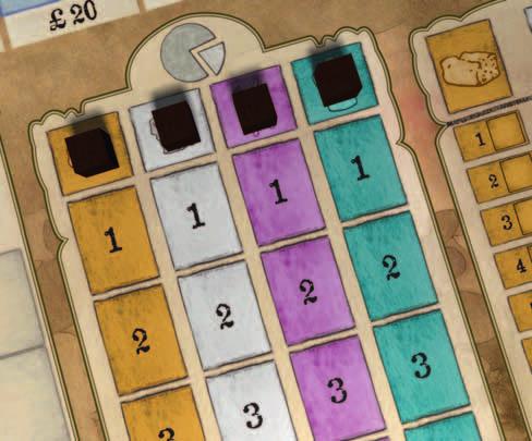 One player places one of the four neutral importer markers on each of the uppermost 'zero' spaces of the market share table (on the symbols of each kind of goods).