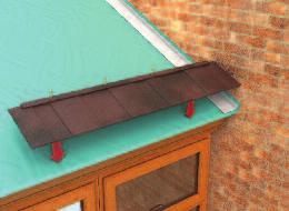 Starting bottom right corner of the roof with a full roof tile, fix to lip of ringbeam and into the corner of