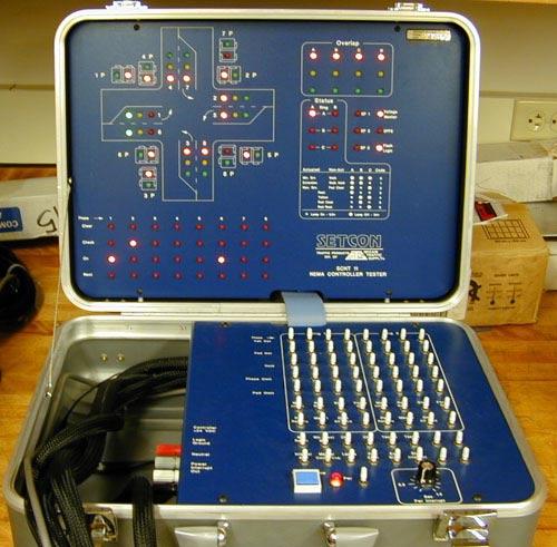 5.1. Background Traditionally, the verification process in the lab has been to use a suitcase tester like the one shown in Figure 5-2a.