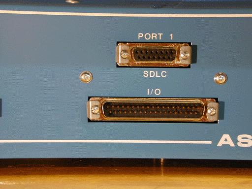 The telemetry port in Figure 3-4b is used when interconnecting local controllers as shown in Figure 3-2.