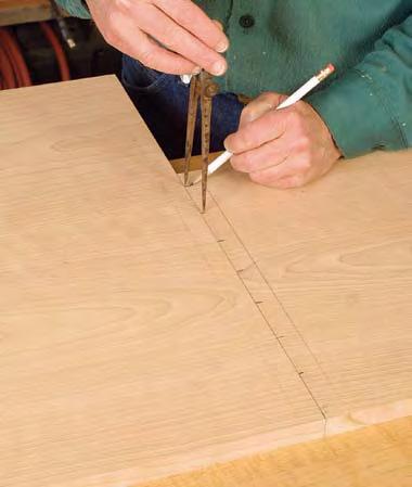 Lay out the dovetails. Use a pair of dividers to lay out the dovetails evenly.