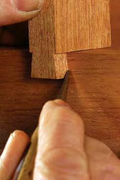 At the workbench, use a shoulder plane to fit the tenons to their mortises. To help keep the outer surfaces flush, avoid paring too much stock from either tenon cheek.