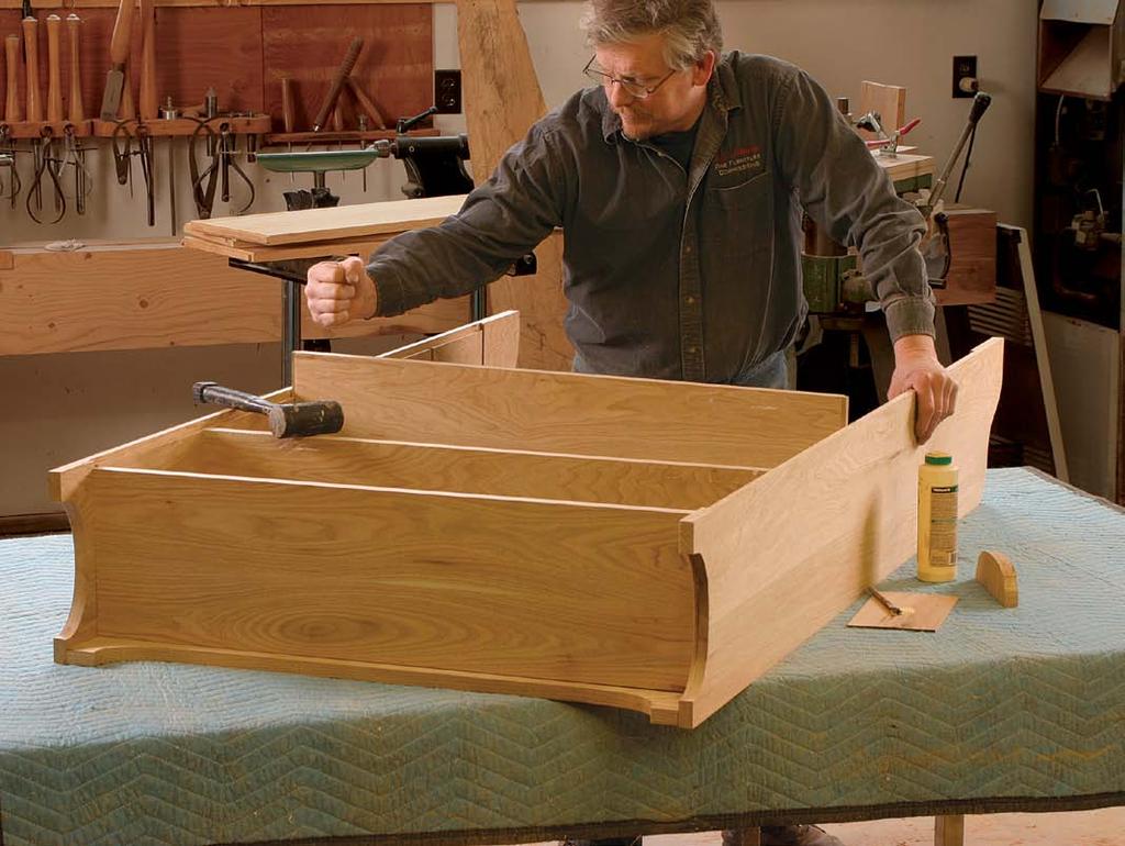 Push and pound. Stand the sides rear-edge up on an assembly bench.