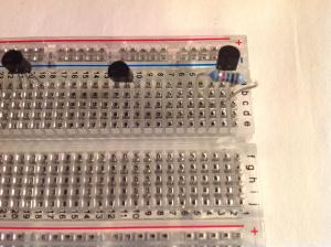 Add the resistor onto the breadboard, one leg should go into column C row 2 and the other leg into column C row 3.