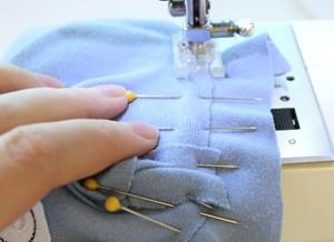 With everything pinned in place, sew a seam along the edge of the opening. Start a little before the opening and end just a little past it, so everything gets closed up nice and neat.