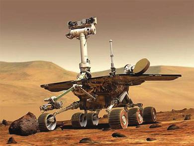 Sojourner sampling a large rock formation on the Martian surface.