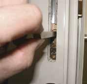 Insert the square profile lock operating bar into the upper square hole in the lock