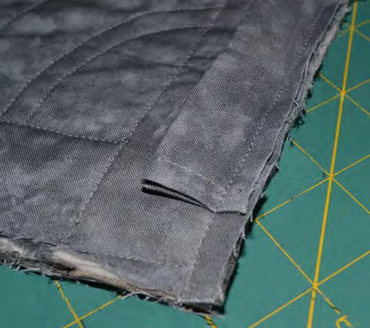 Fold binding strip in half lengthwise, wrong sides together. Press. Cut selvage edges off the binding strip on both ends.