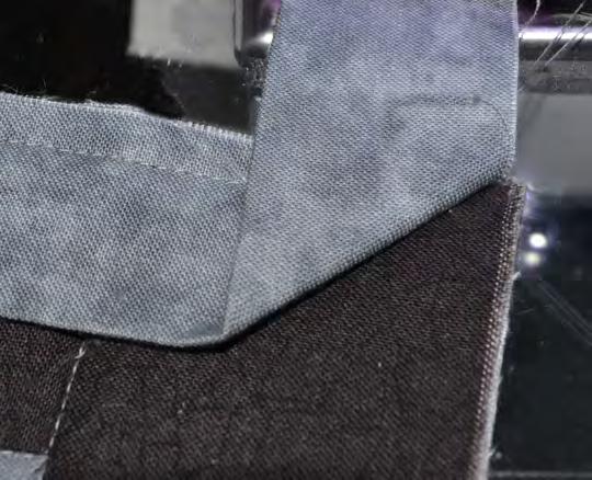 Stitch using a 1/4 seam allowance until 1/4 from the end of the side as shown. Stop with needle down.