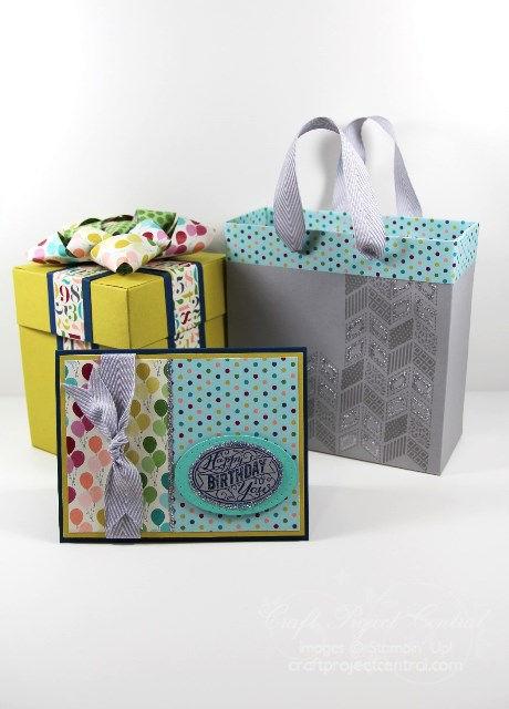 The gift box is an explosion box that has a cute birthday cake in the middle and a pocket in each box side