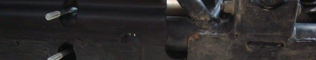 Posi on the nut bar, item #7, up inside the front skid plate as shown (See Illustra on