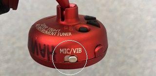 Make sure the switch on the side is set to VIB 2. Use your Pick to pluck your low E string. When the string is in tune, the lights will point to the middle.