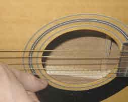 Strum downwards with your index fingernail Strum upwards with your thumbnail USING A PICK You can use a guitar pick instead of