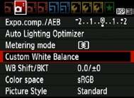 B: Matching the Light SourceN 2 3 4 Select [Custom White Balance]. Under the [2] tab, select [Custom White Balance], then press <0>.
