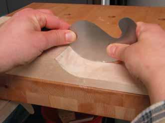smoothing and correcting the transition area with a half-round rasp, then continue with a goose-neck scraper until the