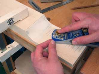 Continue on the back of the peghead, using a well-sharpened block plane to take off material in circular motions.