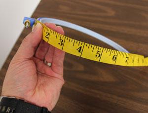 First, measure the circumference of the hoop. I am using a 7" hoop which measures 23 1/2" around.