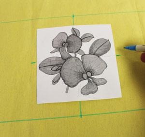 Create a paper template of the design by printing it at full size using embroidery software.
