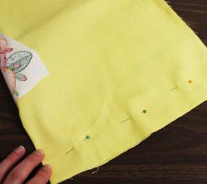only. Pin the fabric along the bottom edge and sew a 1/2" seam.