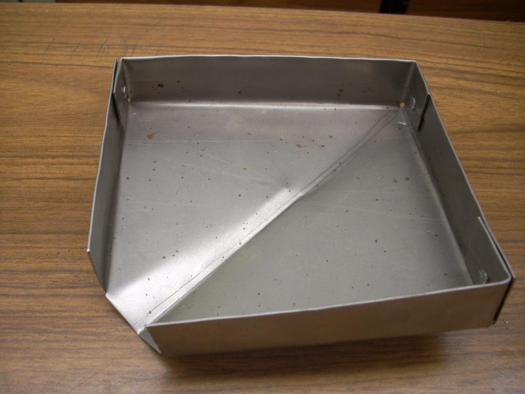 The open space flanking these fingers is room for the adjacent sides of the tray.