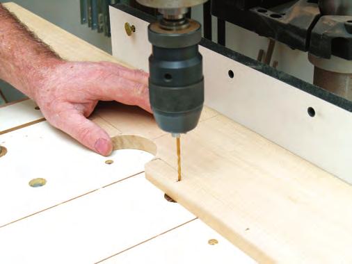 Make a set of wooden zero-clearance inserts to fit the hole.