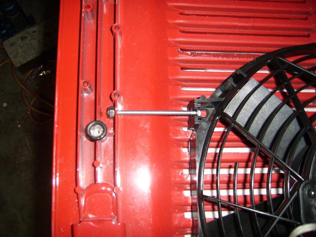 Tighten both nuts to tension bolts to the point that the fan is well