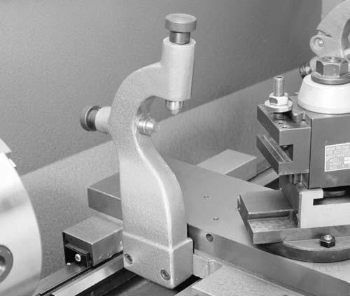 Follow Rest The follow rest is normally used with small diameter stock to prevent the workpiece from springing under pressure from the turning tool. To install the follow rest: 1.