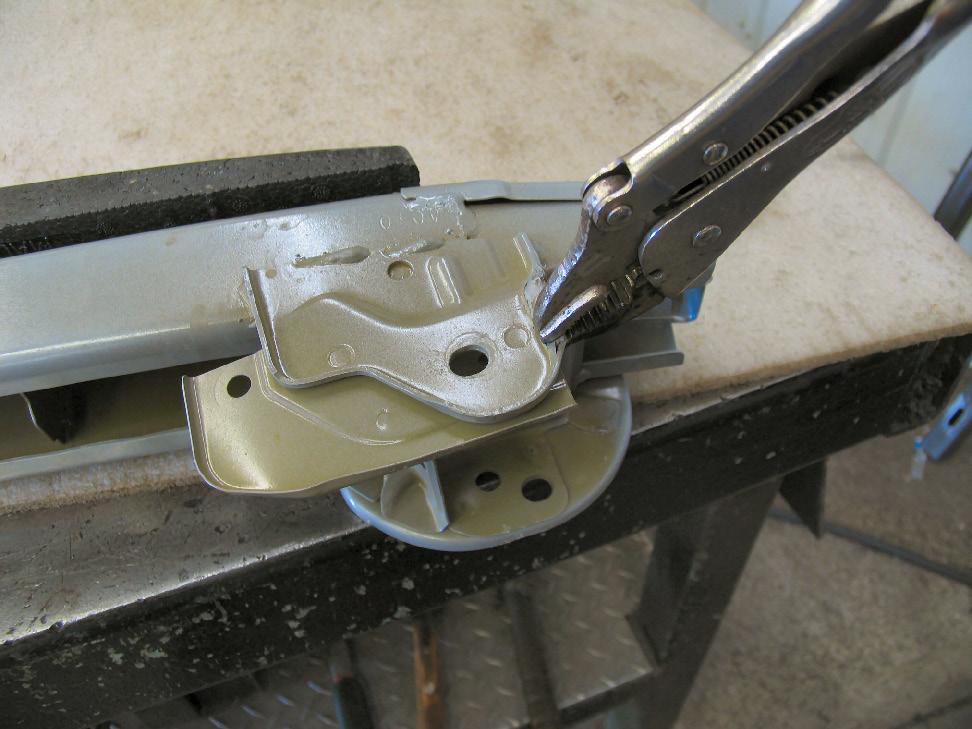 11 11. Using a reciprocating saw, make one cut on the top of the outside edge of the ribbing inside the frame rail and one cut on the bottom of the outside edge of the ribbing inside the frame rail.