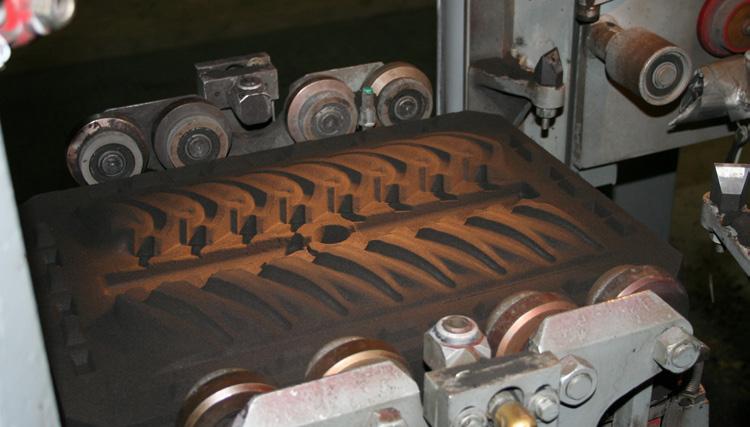 The molding machine will produce the cope and drag sides of the mold (Figure 26) and assemble them (Figure 27).