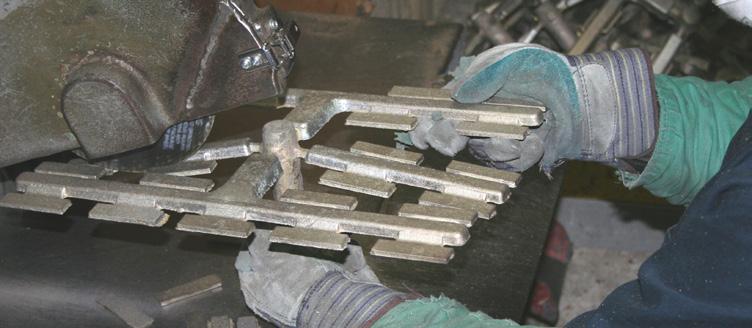 Figure 31: Raw window handle casting ready for finishing. Figure 32: Finishing Touch Smoothing Station.