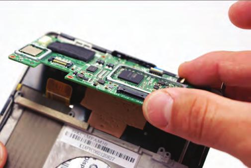 Use the appropriate screwdriver to remove and free the motherboard from its